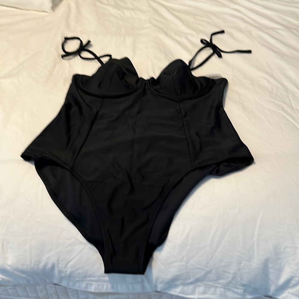 Black one piece swimsuit. Tie details.